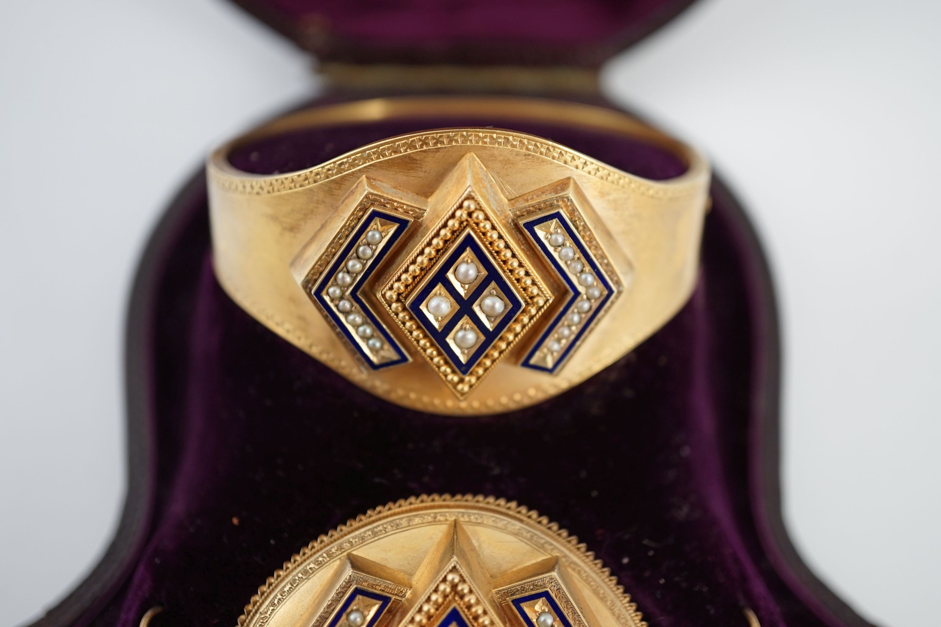 A cased Victorian gold, seed pearl and blue enamel parure